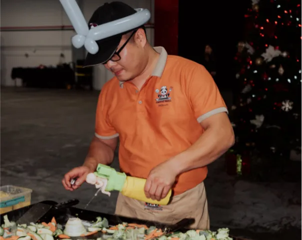 Hibachi chef cooking fried rice in United States